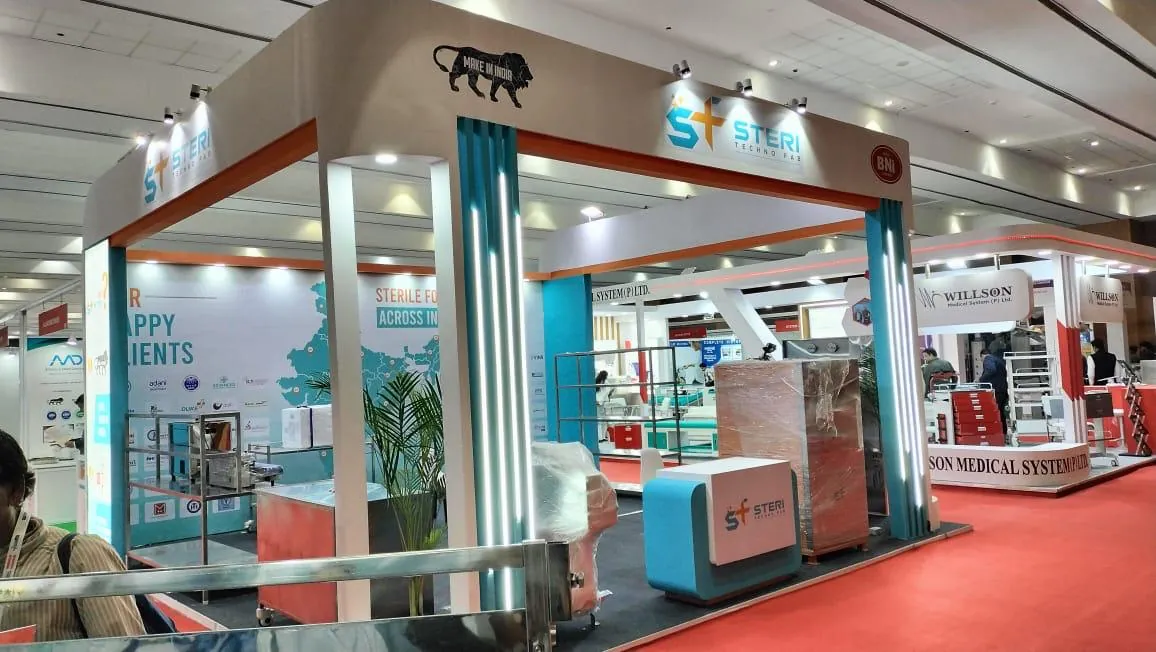 A Steri exhibition booth entrance topped with a black panther figure and teal curtains at a trade show.